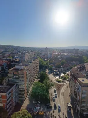 an overhead view of a city with buildings and a street at Plan B in Niš