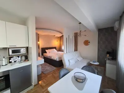 a room with a bed and a living room at Astera 3 in Vrnjci