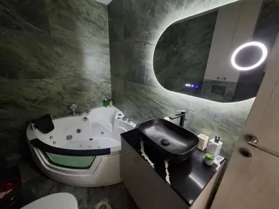 a bathroom with a toilet and a sink with a smiley face on it at Astera 3 in Vrnjci