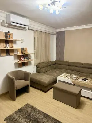 a living room with a couch and a table at Apartman Dolly Vrnjacka banja in Vrnjačka Banja