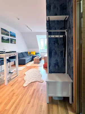 a kitchen and living room with a refrigerator at Oaza Kopaonik in Kopaonik