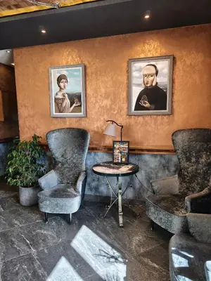 a waiting room with two chairs and a table at Oaza Kopaonik in Kopaonik