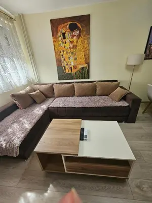a living room with a large couch and a table at Anastasija Lux 2 in Paraćin