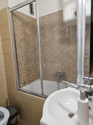 a bathroom with a sink and a bath tub at Anastasija Lux 2 in Paraćin