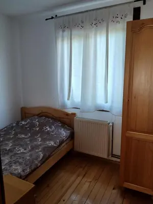 a small bedroom with a bed and a window at Kuća za odmor in Bukorovac