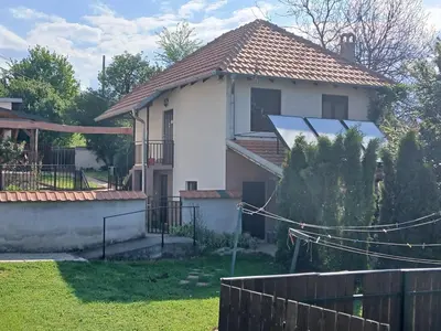 a house with a solar panel on the roof at Kuća za odmor in Bukorovac