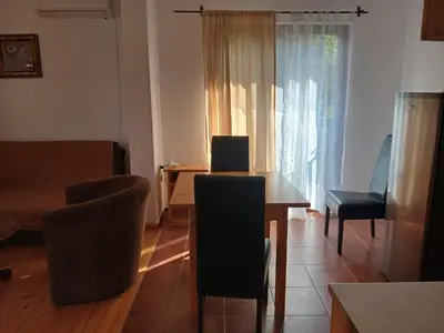 a living room with a table with a laptop on it at Kuća za odmor in Bukorovac