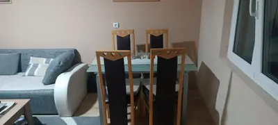 a living room with a glass table and a couch at Vila Piramida - Zavojsko jezero-Pirot in Bukorovac