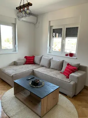 a living room with a couch and a coffee table at Apartman Stević in Vrnjci