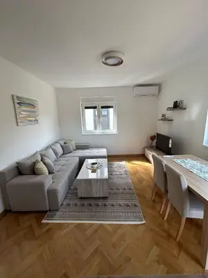 a living room with a couch and a table at Apartman Stević in Vrnjci