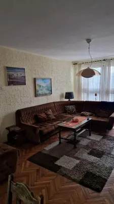 a living room with a couch and a coffee table at Apartman19 Resavica in Železnička Stanica Resavica