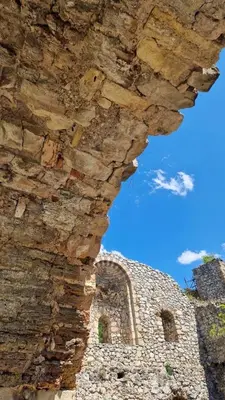 an old stone building with a stone wall at Apartman19 Resavica in Železnička Stanica Resavica