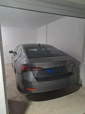 a car is parked in a parking garage at MIL apartment Sokobanja in Soko Banja
