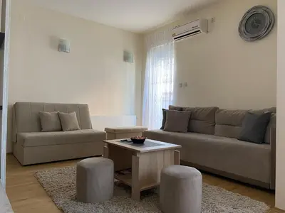 a living room with a couch and a table at Apartman Đalić in Vrnjačka Banja
