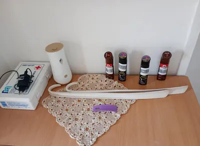 a knife and other items on a wooden table at BoHan sobe Vladičin Han in Vladičin Han