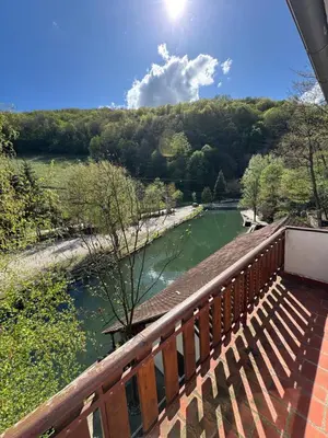 a view of a river from a bridge at Lisine Ribnjak in Despotovac