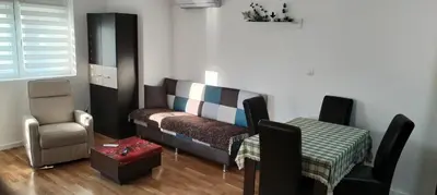 a living room with a couch and a chair at Mila in Soko Banja