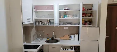 a small kitchen with a sink and a refrigerator at Mila in Soko Banja