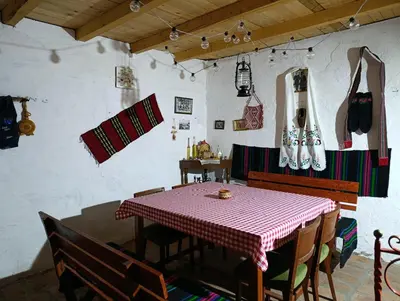 a dining room with a table and chairs in a room at Vila Jagoda in Bojnik