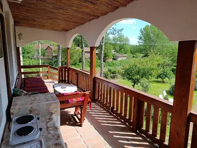 a porch with a view of a yard at Vila Jagoda in Bojnik