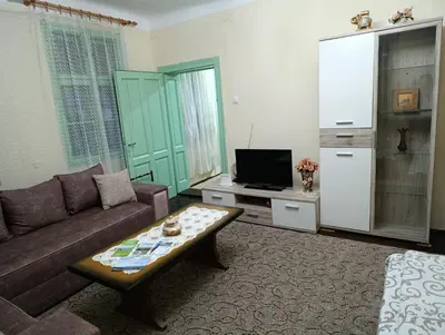 a living room with a couch and a coffee table at Vila Jagoda in Bojnik