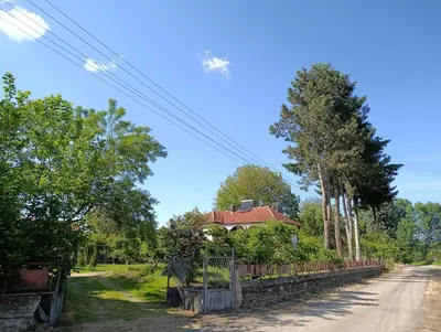 a house on the side of a dirt road at Vila Jagoda in Bojnik