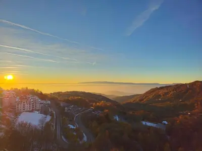 a view of the sunset from the top of a mountain at Apartman The Nest in Kopaonik