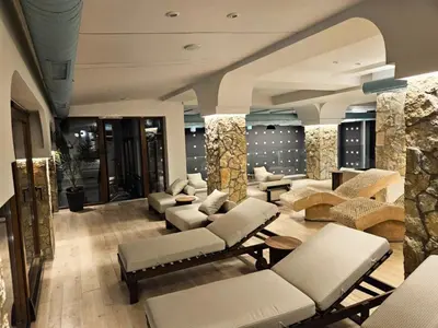 a lobby with couches and chairs in a building at Apartman The Nest in Kopaonik