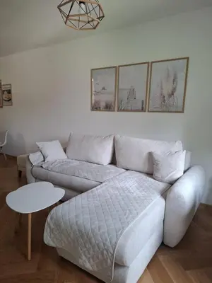a living room with a couch and a table at Nikana in Vrnjačka Banja
