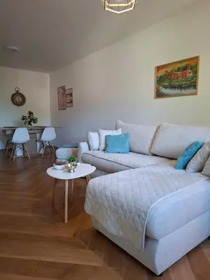 a living room with a couch and a table at Nikana in Vrnjačka Banja