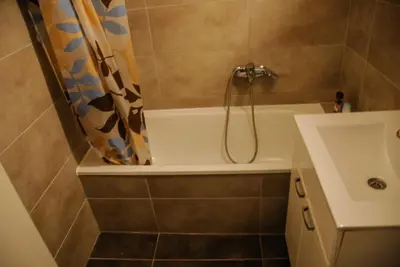 a bathroom with a bath tub and a sink at River lux in Bukorovac