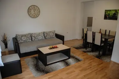 a living room with a couch and a table at River lux in Bukorovac