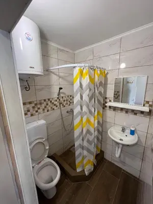 a small bathroom with a toilet and a sink at Studio in Soko Banja