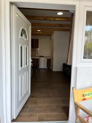 an open door to a hallway with a kitchen at Studio in Soko Banja