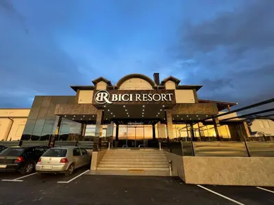 a building with a sign that reads bright resort at Bici Resort in Samoljica