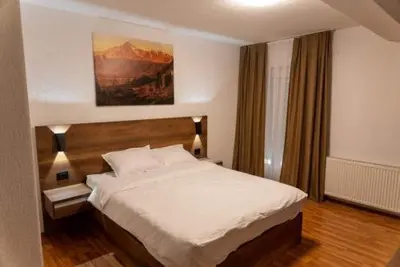 a bedroom with a large bed in a room at Bici Resort in Samoljica