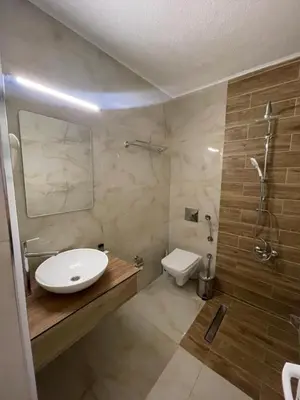 a bathroom with a sink and a shower and a toilet at Bici Resort in Samoljica