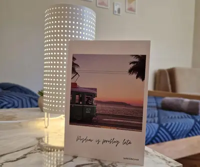 a card with a picture of a train on a table at Apartmani Central Vrnjačka Banja Šetalište in Vrnjačka Banja