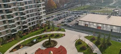 an aerial view of a parking lot with cars parked at Planet-A1012 in Niš