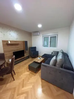 a living room with a couch and a table at Banjski Raj in Vrnjačka Banja