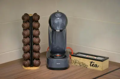 a blender sitting on a table next to a box at Amazon Royale Apartment in Niš