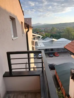 a balcony with a view of a parking lot at Bufan apartman in Soko Banja