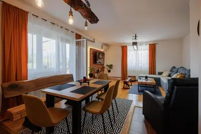 a living room with a table and chairs at Apartman Pepa in Pirot