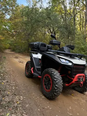 a four wheeler parked on a dirt road at Etno selo Čubura in Čubura