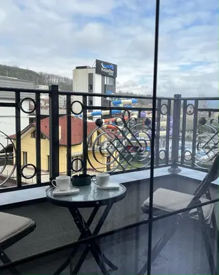 a balcony with a table and two cups of coffee at Slatina Točak in Vrnjačka Banja