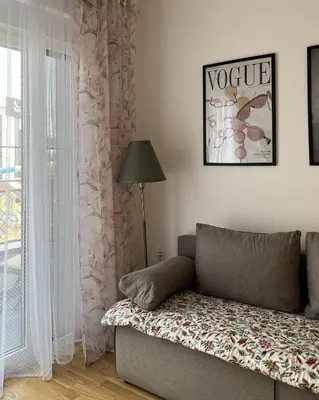 a living room with a couch and a window at Slatina Točak in Vrnjačka Banja