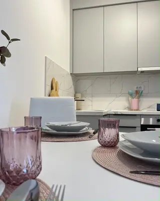 a kitchen with plates and utensils on a counter at Slatina Točak in Vrnjačka Banja
