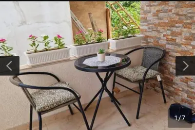 two chairs and a small table on a patio at Relax 2 in Bukorovac
