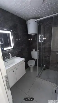 a bathroom with a shower and a toilet and a sink at Relax 2 in Bukorovac
