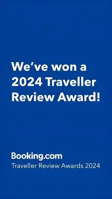 a blue sign that says weve won a traveler review award at Emilija Apartments in Soko Banja